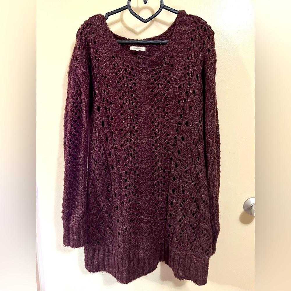 Cozy extra long sweater with detailed, integrated designs